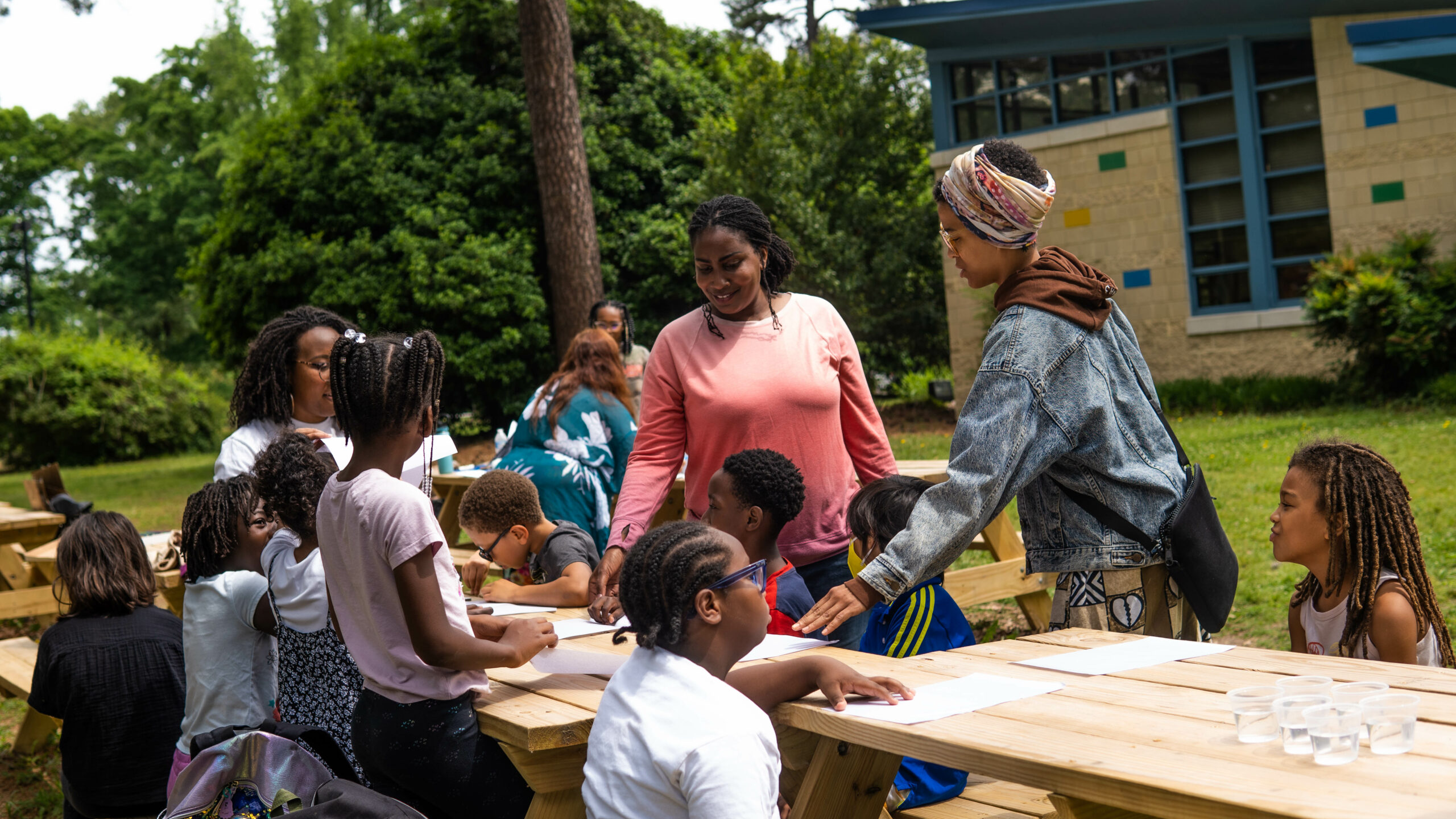 A group of students at picnic tables